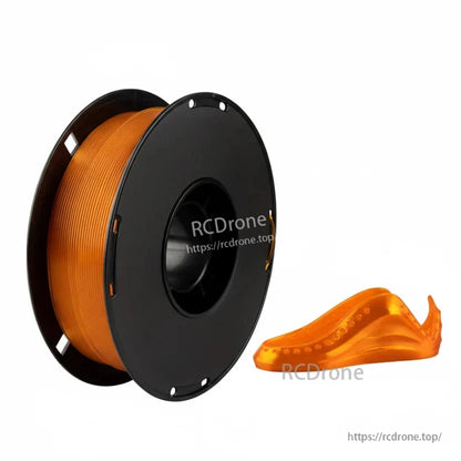 Orange flexible 3D printing filament on a black spool with a small orange printed sample part