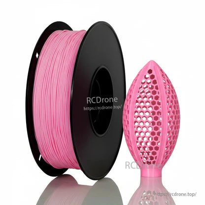 Light pink filament spool with honeycomb lattice football-shaped sample print