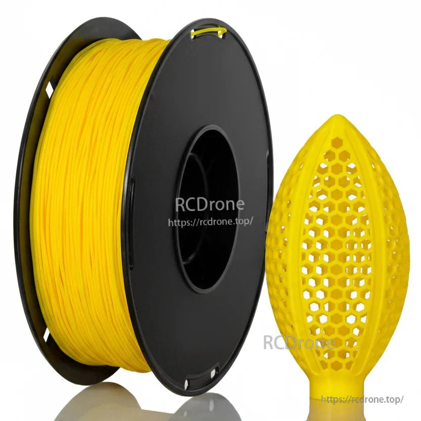 Yellow filament spool with honeycomb lattice football-shaped sample print