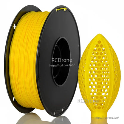 Yellow filament spool with honeycomb lattice football-shaped sample print