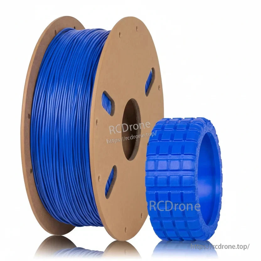 Dark blue filament on cardboard spool with tread ring sample print