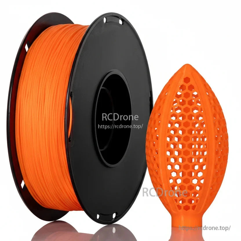 Orange filament spool with honeycomb lattice football-shaped sample print
