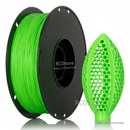 Bright green filament spool with honeycomb lattice football-shaped sample print