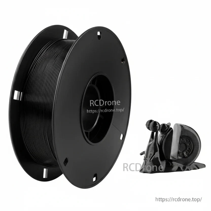 Black TPU 3D printing filament spool with sample flexible printed parts beside it