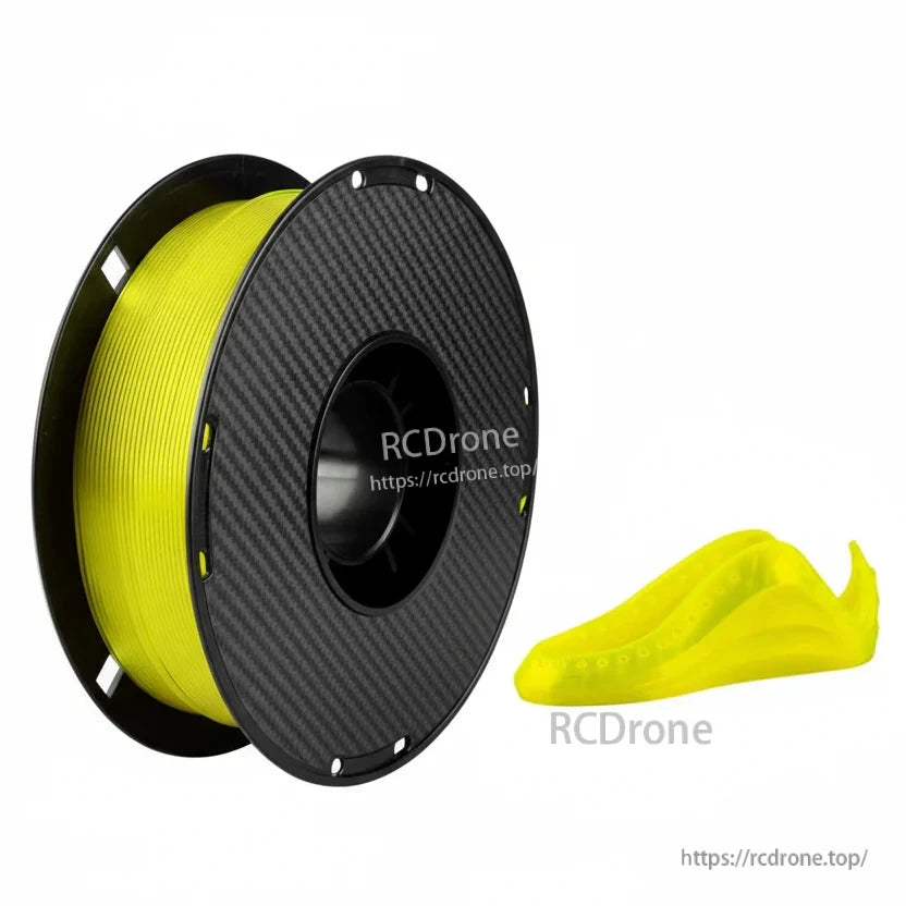 Yellow TPU 3D printing filament spool with carbon-fiber style reel, next to a small flexible printed part