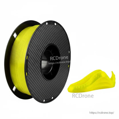Yellow TPU 3D printing filament spool with carbon-fiber style reel, next to a small flexible printed part