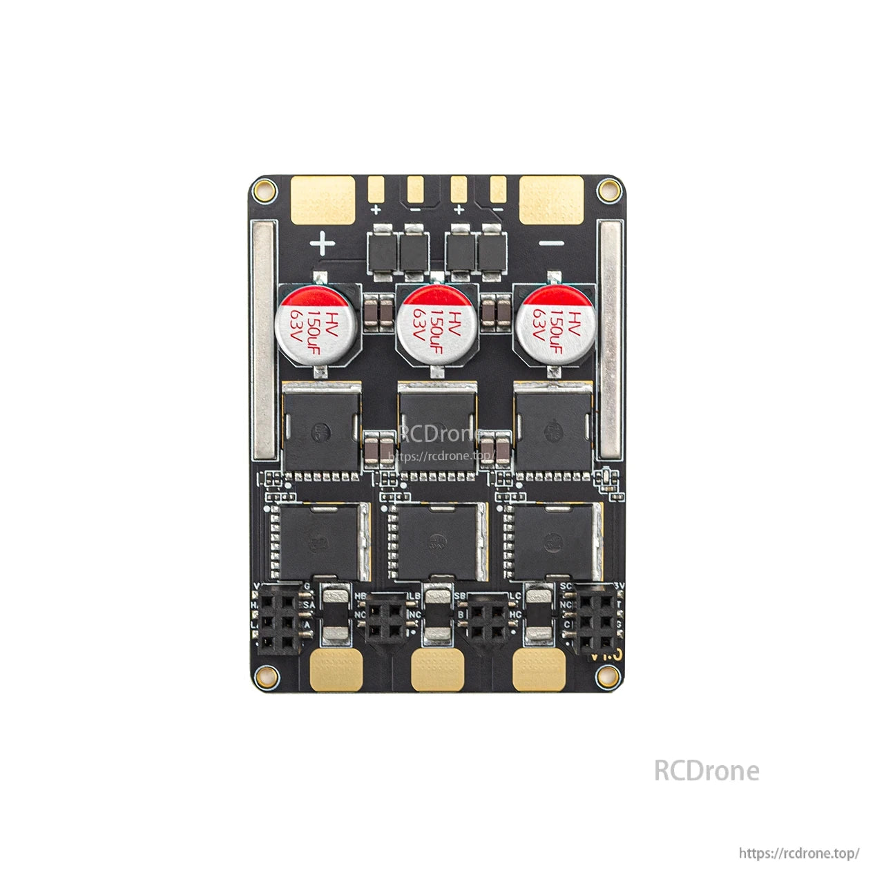 Power stage PCB view with three large capacitors and MOSFET layout, motor pad area at top