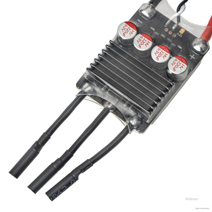 Close-up of heatsink end with three motor wire leads and protective heatshrink on each wire