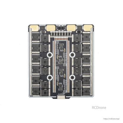 Bottom view of 4-in-1 ESC board showing MOSFET banks, center controller area, and mounting holes