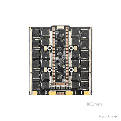 Underside of the 4-in-1 ESC showing MOSFET array and central signal/bridge section