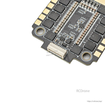 Close-up of ESC JST plug connector and adjacent solder points on the board