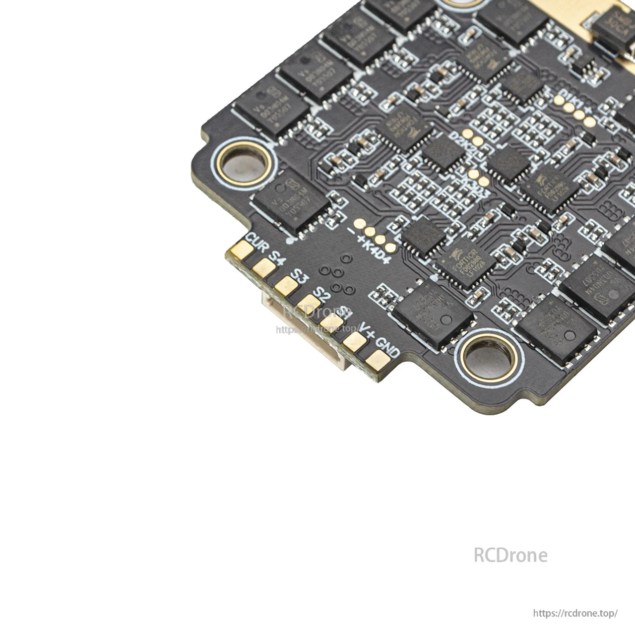 Close-up of signal pad row labeled CUR, S4, S3, S2, V+, GND on the ESC