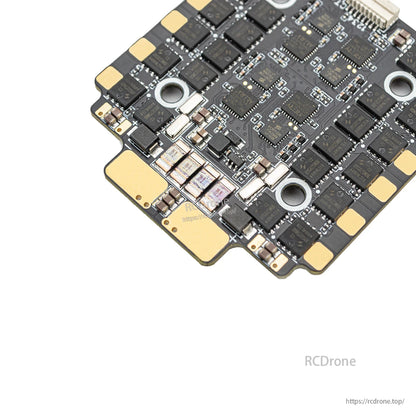 Close-up of ESC battery pads and power components near board edge, with solder points detail