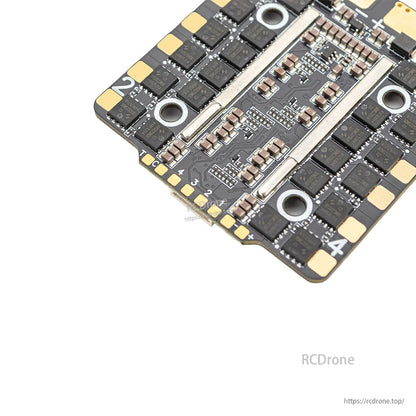 Close-up of ESC power section with metal heat spreader bars and surrounding capacitors