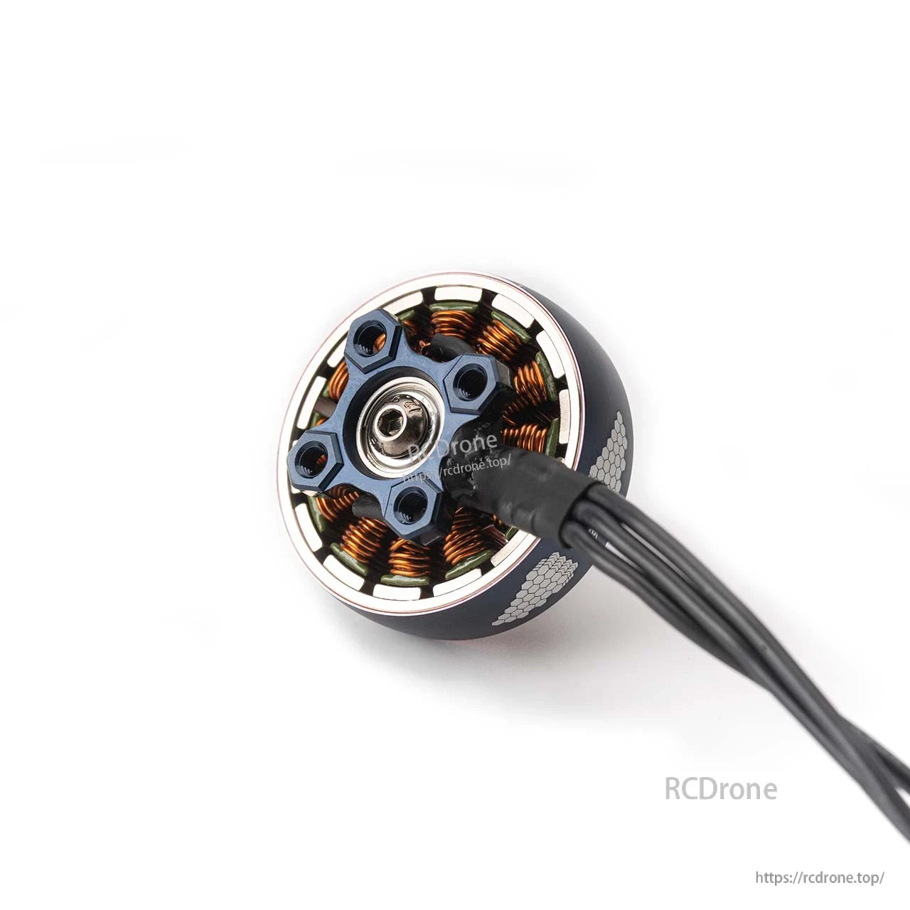 Bottom view showing mounting screw holes, bearing, stator windings, and attached motor wires