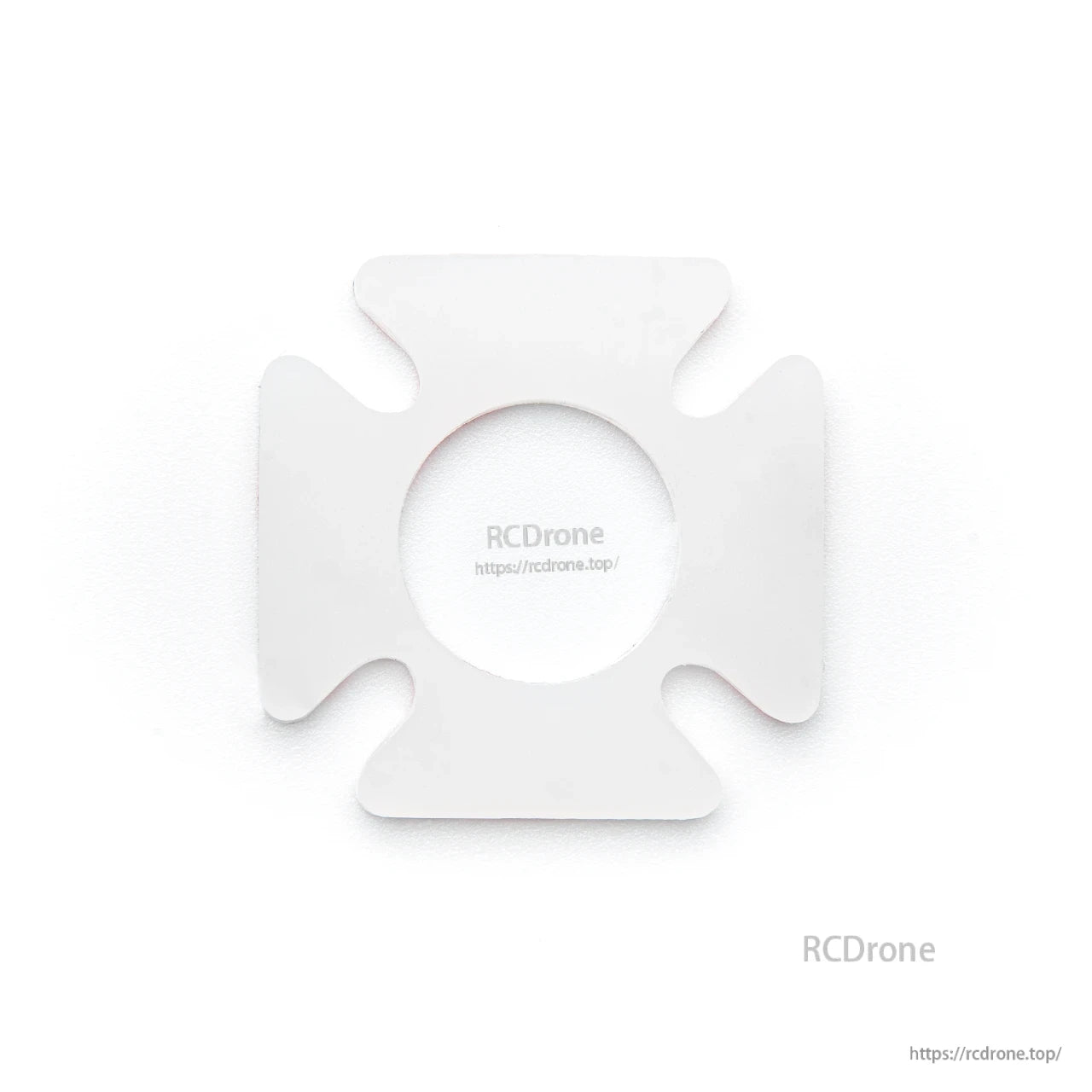 White spacer/adapter plate with center circular cutout and four rounded tabs