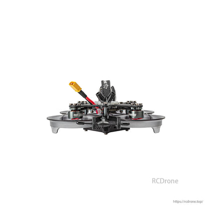 Rear view showing standoff stack, battery lead routing, and ducted guards on the 2-inch frame