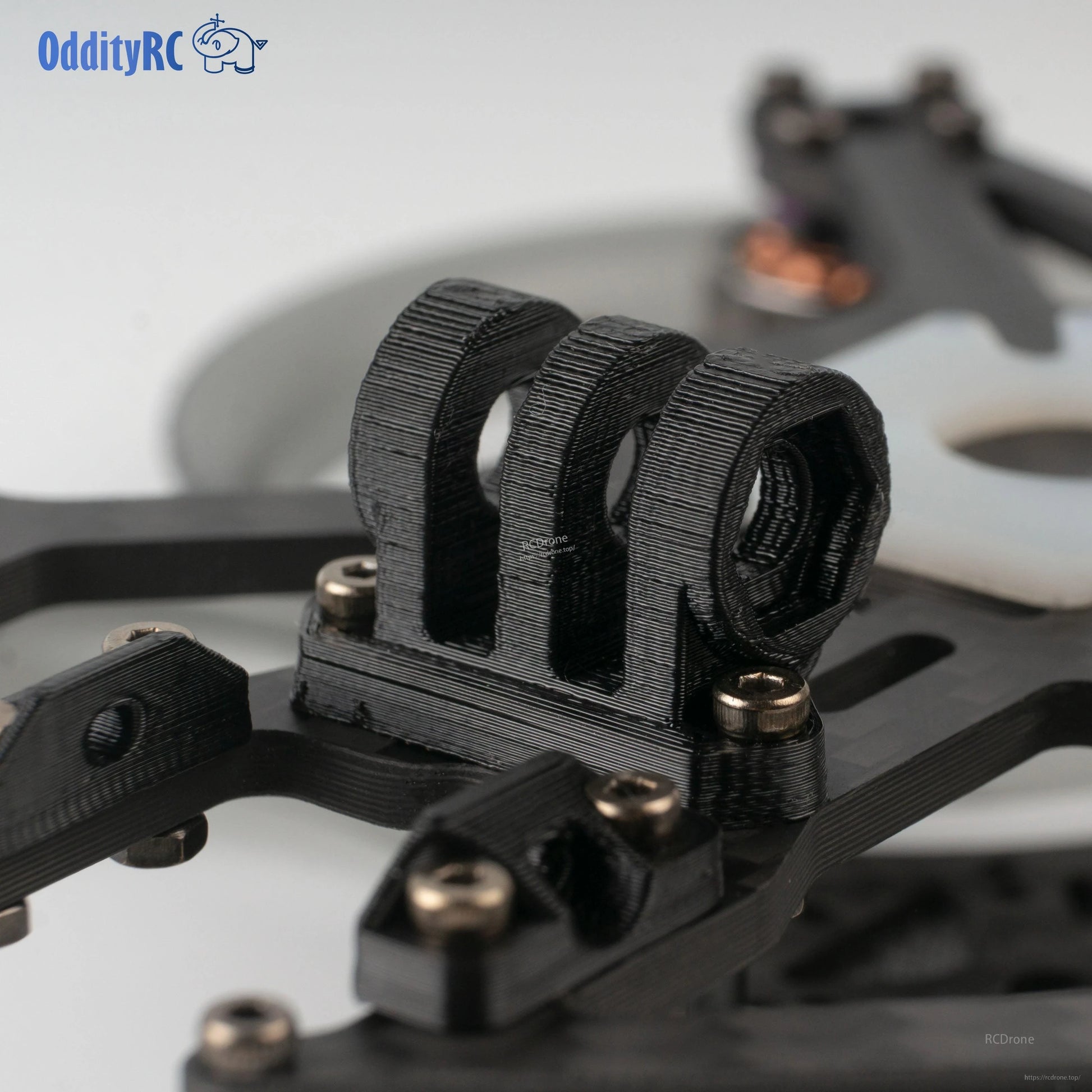 Close-up of 3D-printed camera cage/canopy mount on the frame plate