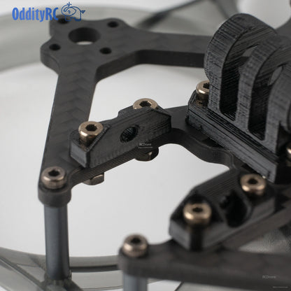 Close-up of top plate mounting bracket and screw hardware on OddityRC frame