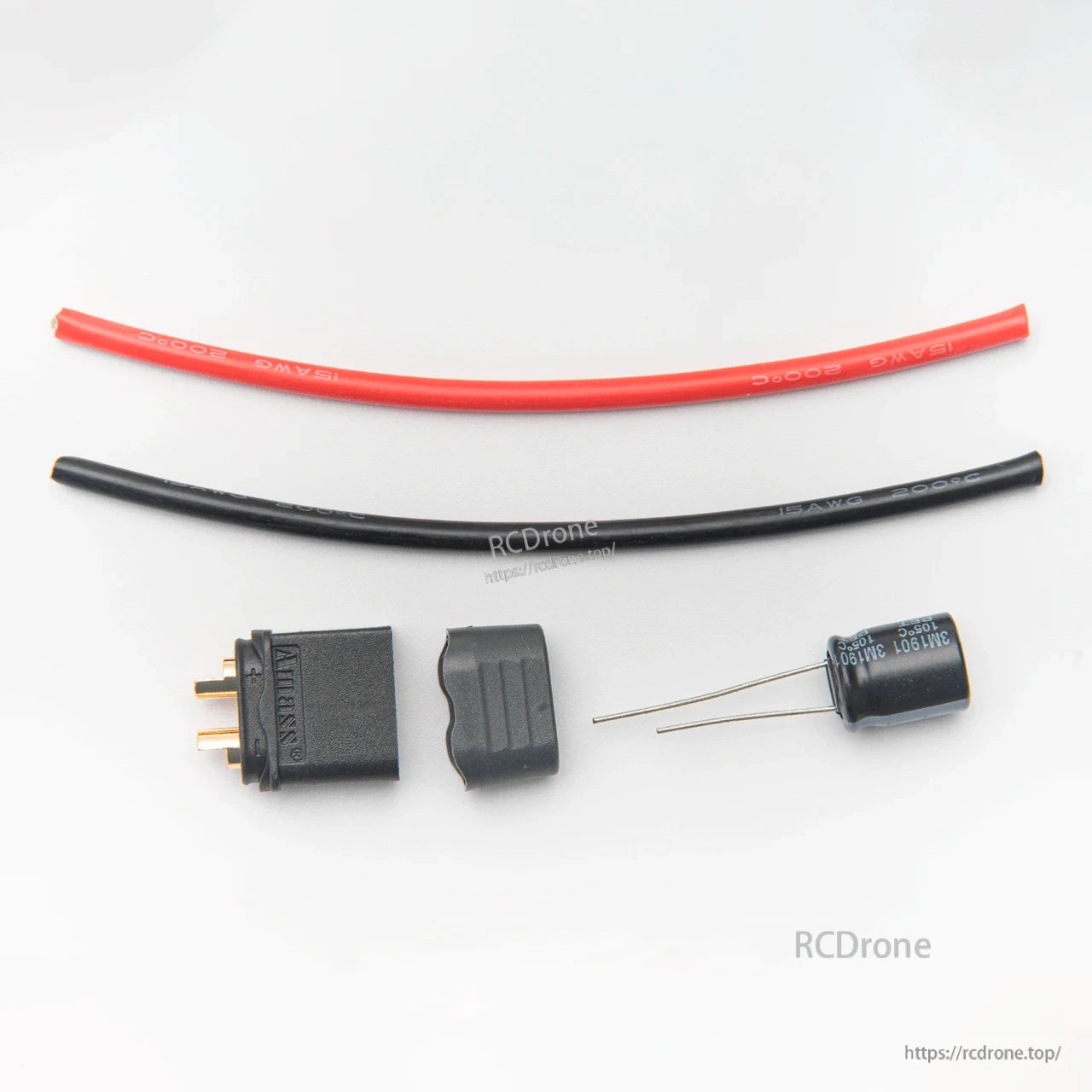 Power lead parts: red and black wire, connector housing, and electrolytic capacitor