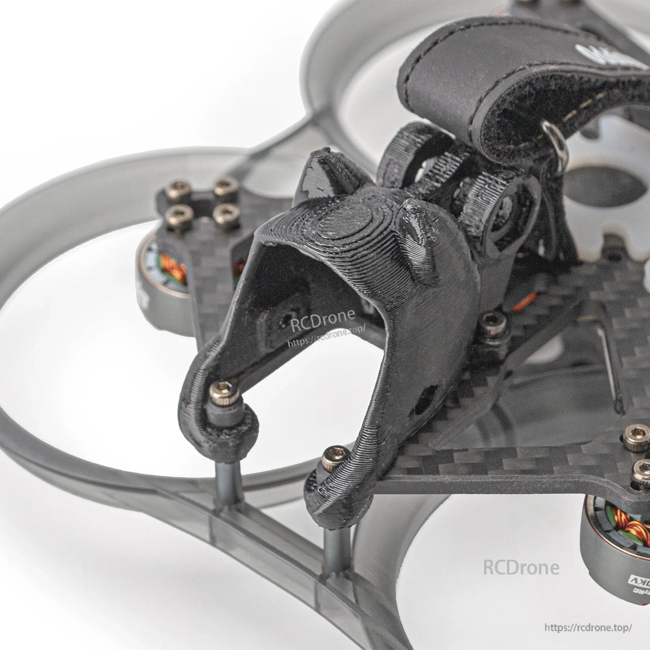 Close-up of front camera mount and standoffs on the carbon frame with duct ring in the background