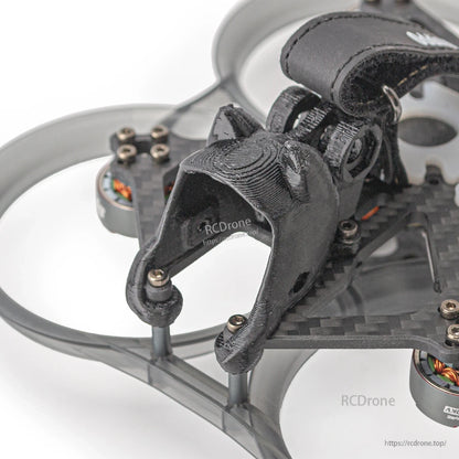 Close-up of front camera mount and standoffs on the carbon frame with duct ring in the background