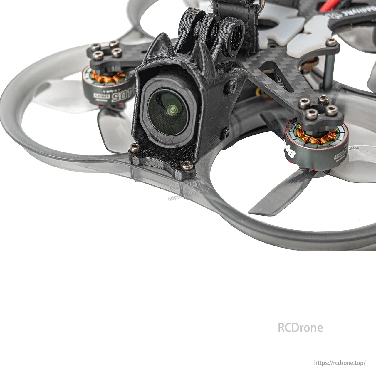 Close-up of FPV camera mount and front ducted prop area with micro brushless motors