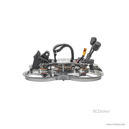 Side profile of ducted FPV quad showing carbon frame, battery strap, and rear antennas