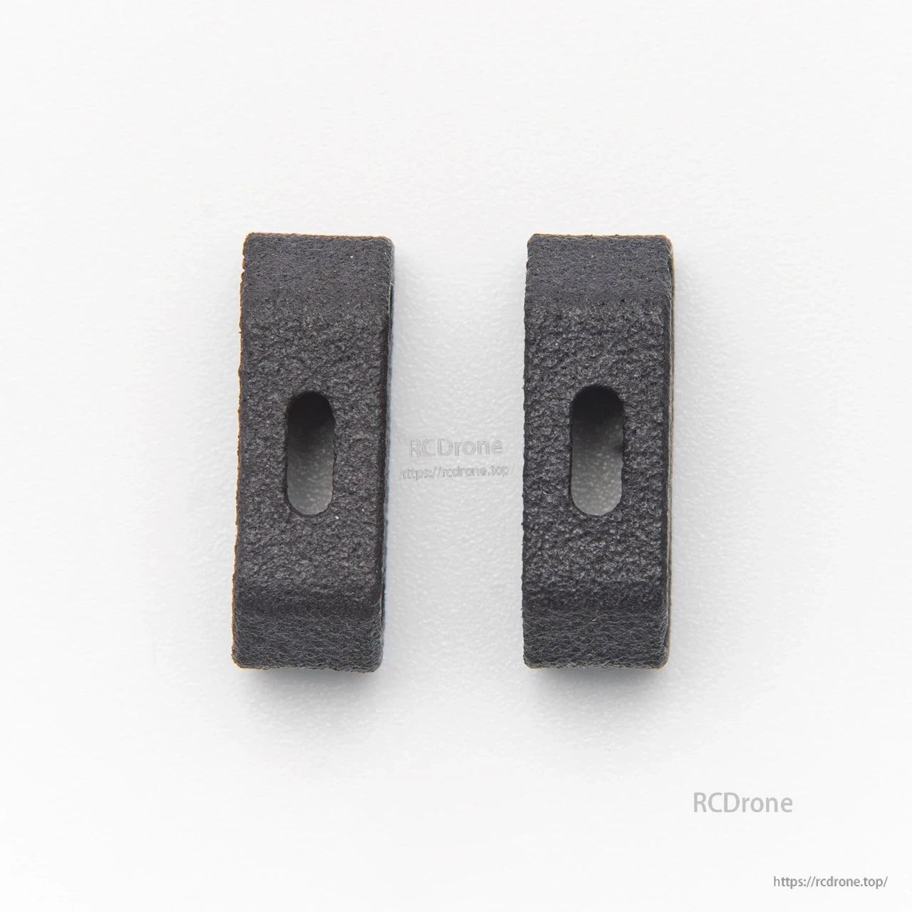 Pair of black foam battery pads with oval slots, two-piece set