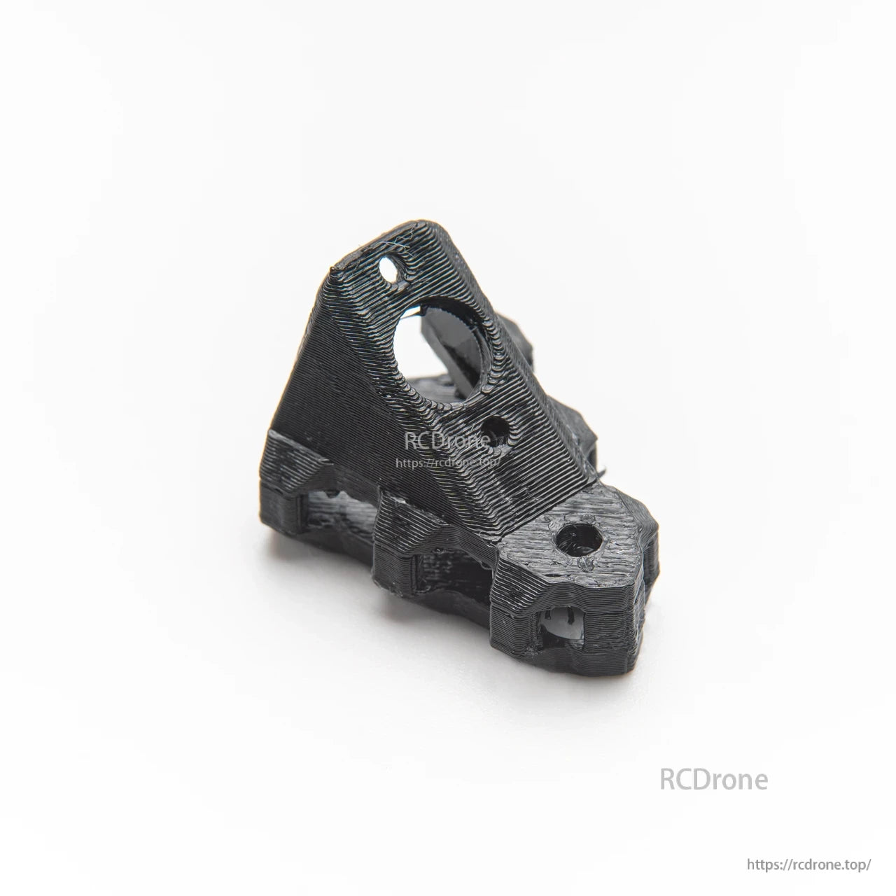 Black 3D-printed angled mount bracket with circular opening and screw holes