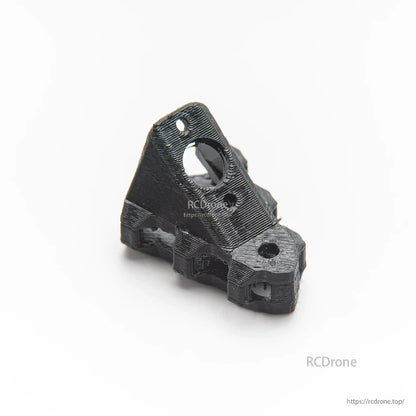 Black 3D-printed angled mount bracket with circular opening and screw holes