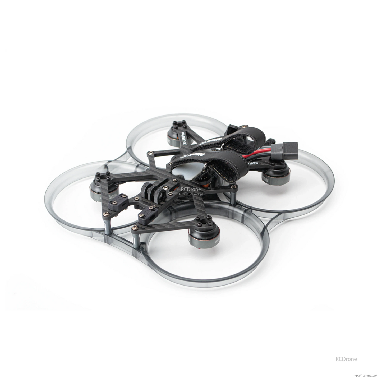 Angled rear-side view of ducted cinewhoop with battery strap and power connector lead visible