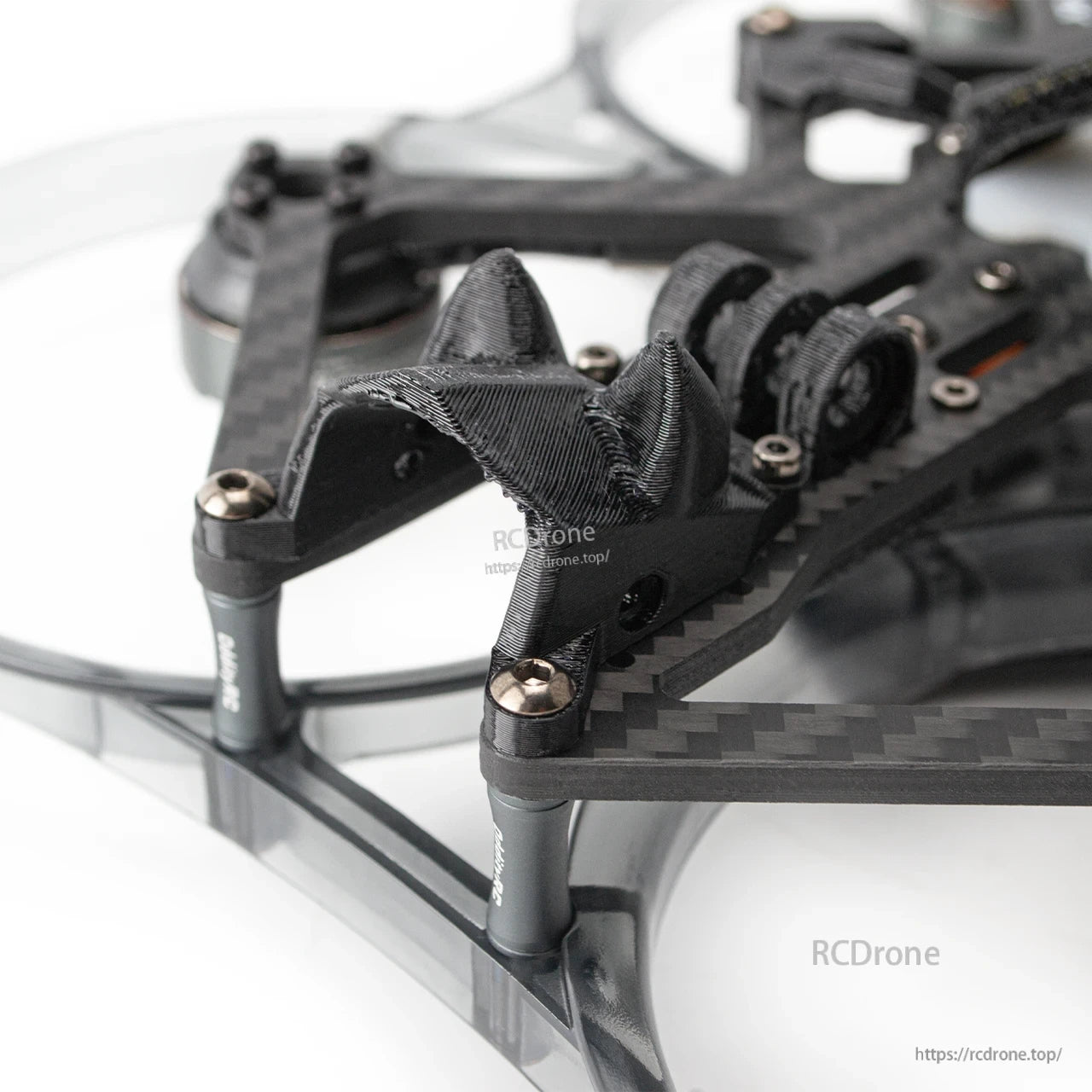 Close-up of front camera mount area with 3D-printed bracket and carbon fiber frame hardware