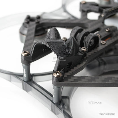 Close-up of front camera mount area with 3D-printed bracket and carbon fiber frame hardware