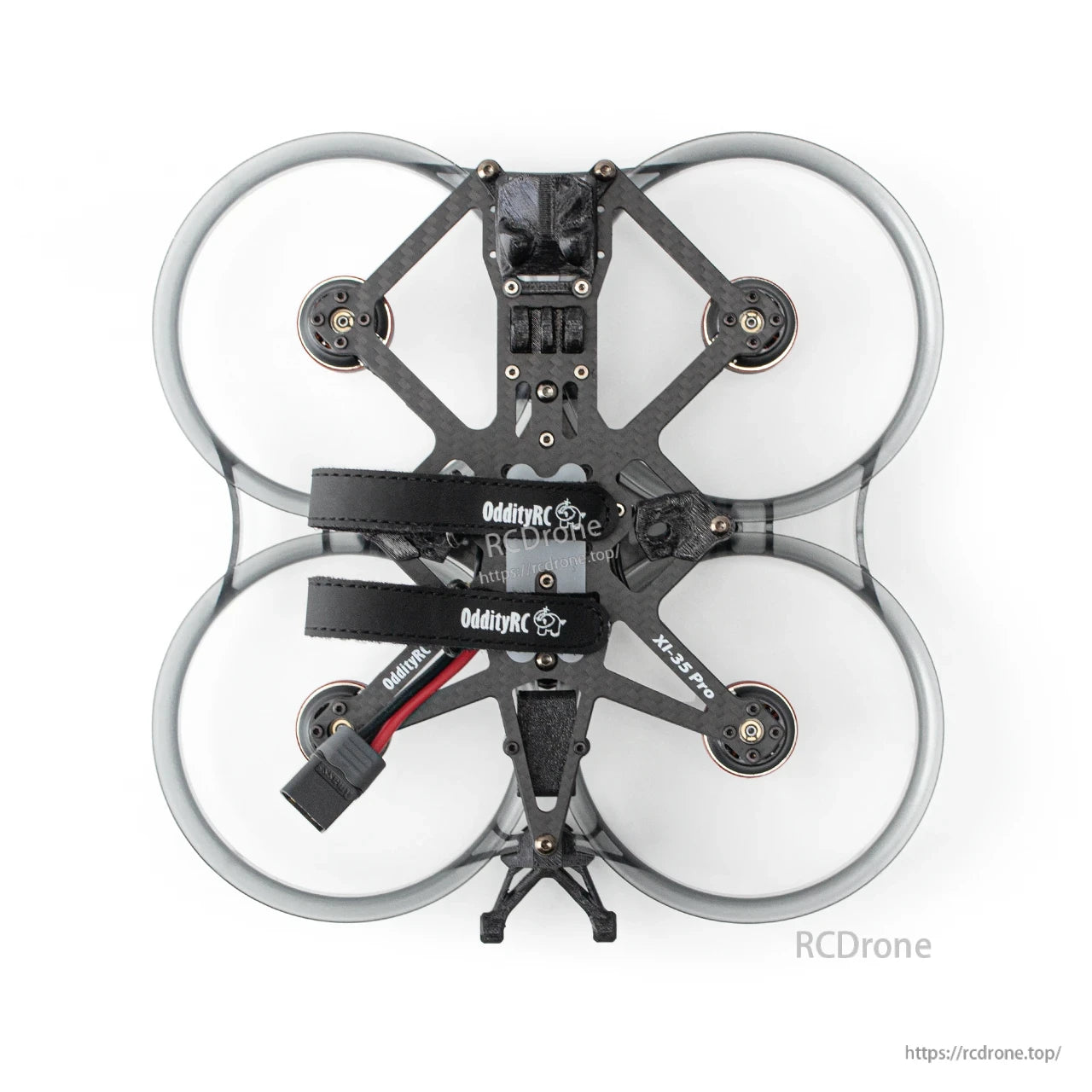 Top-down view of carbon fiber cinewhoop frame with four ducts and dual OddityRC battery straps
