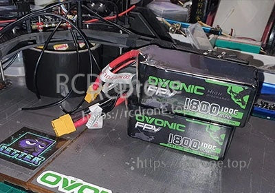 Two Ovonic FPV 1800mAh 6S LiPo packs with XT60 connectors on a workbench