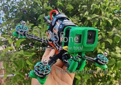 FPV quadcopter with action camera and a strapped LiPo battery pack for freestyle flights