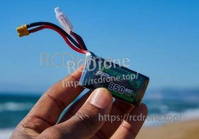 Handheld Ovonic 850mAh 80C 4S LiPo battery showing XT30 connector and balance plug on leads
