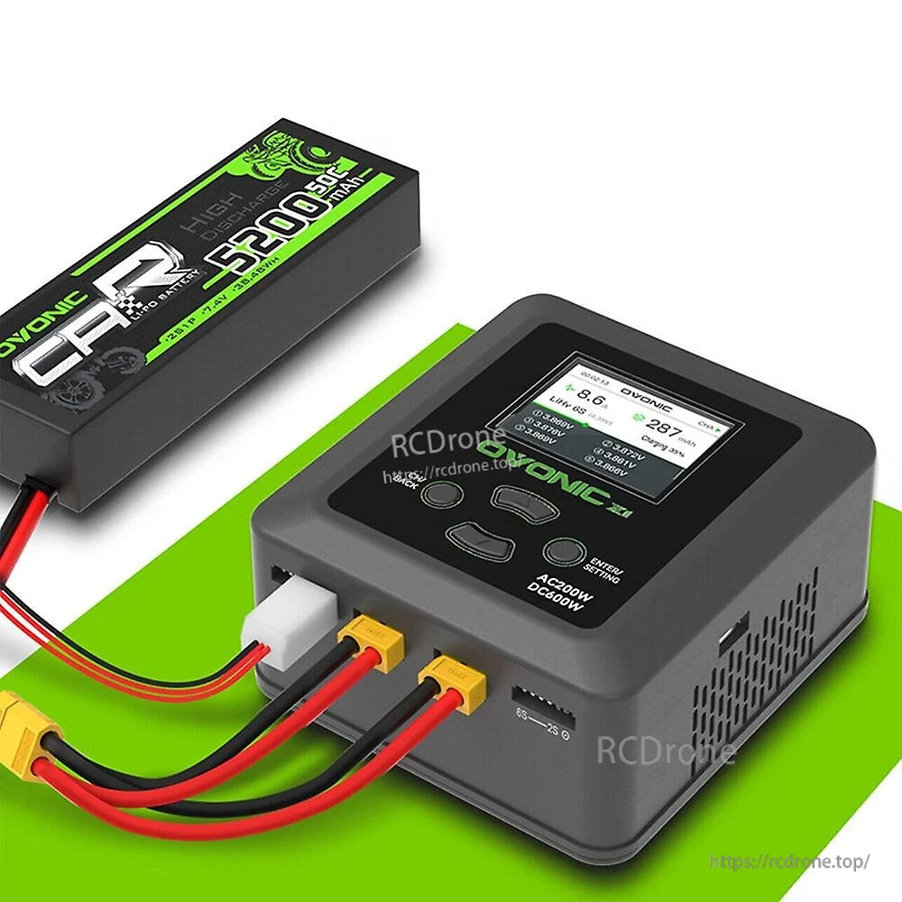 Ovonic X1 Pro dual-channel RC charger shown charging a LiPo battery pack with connected leads