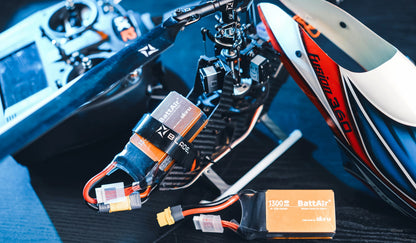 RC LiPo battery pack (BattAir 1300mAh) with XT60-style power plug and balance lead mounted on an RC helicopter