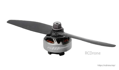 RCINPOWER GTS V2 2306 brushless FPV drone motor with two-blade propeller, gray bell and visible copper windings