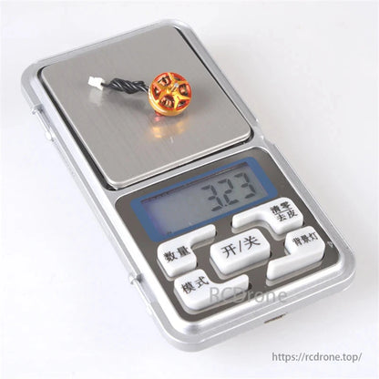 RCINPOWER GTS V3 1003 brushless FPV motor for micro drones weighs 3.23 grams on digital scale.