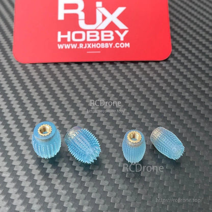 RJX 1 Pair Thumb Grippies Non-Slip Radio Stick, RJX Hobby blue non-slip radio stick thumb grippies with brass threaded inserts, set on carbon-fiber surface