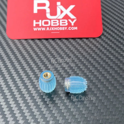 RJX 1 Pair Thumb Grippies Non-Slip Radio Stick, Pair of RJX blue non-slip radio stick thumb grippies with brass threaded inserts on carbon-fiber surface