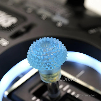 RJX 1 Pair Thumb Grippies Non-Slip Radio Stick, Blue textured RJX thumb grippy installed on a radio transmitter stick for a non-slip grip upgrade.