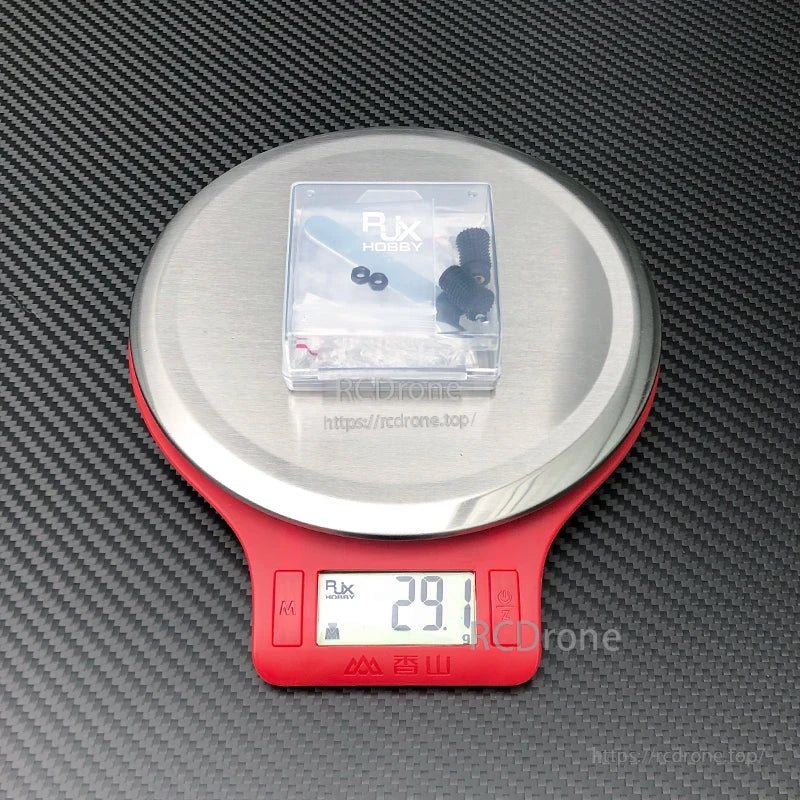 RJX 1 Pair V2 M4 Rocker Joystick, RJX Hobby V2 M4 rocker joystick parts set in a clear case on a digital scale reading 29.1 g