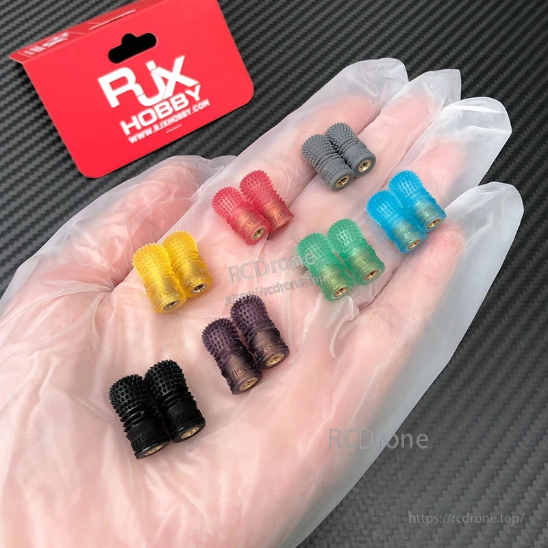 RJX 1 Pair V3 M4 Anti-Slip Gimbal Stick, RJX Hobby V3 M4 anti-slip gimbal stick with knurled metal tip in gloved hand, in RJX packaging