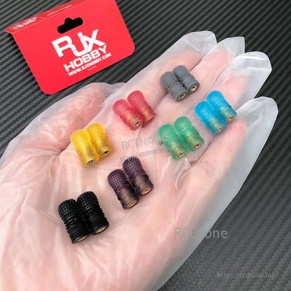 RJX 1 Pair V3 M4 Anti-Slip Gimbal Stick, RJX Hobby V3 M4 anti-slip gimbal stick with knurled metal tip in gloved hand, in RJX packaging