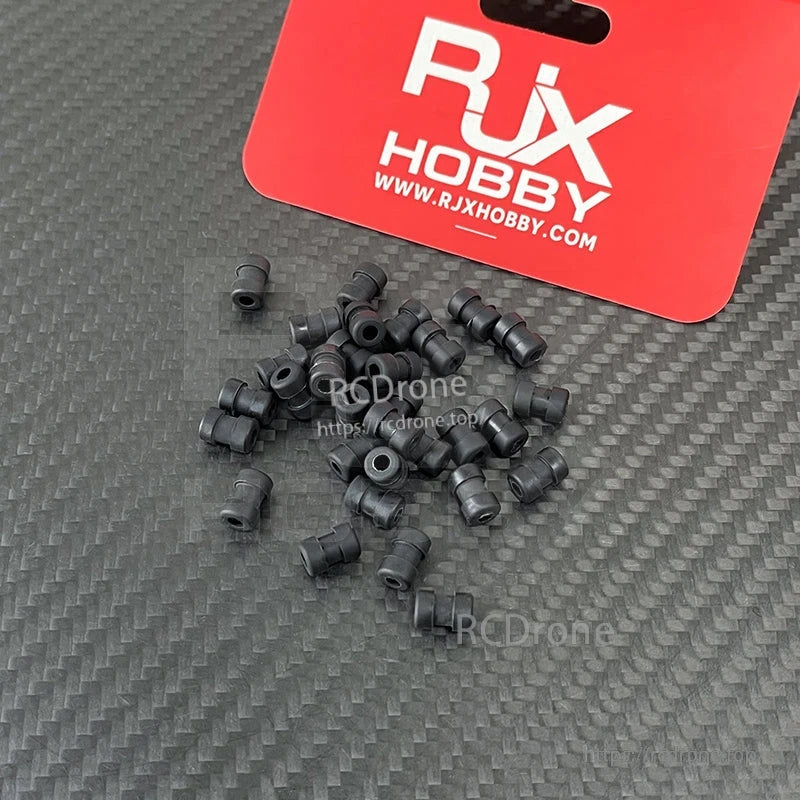 RJX 100pcs Damping Ball, RJX Hobby black rubber damping balls for RC/drone mounting, shown as a small pile with RJX tag