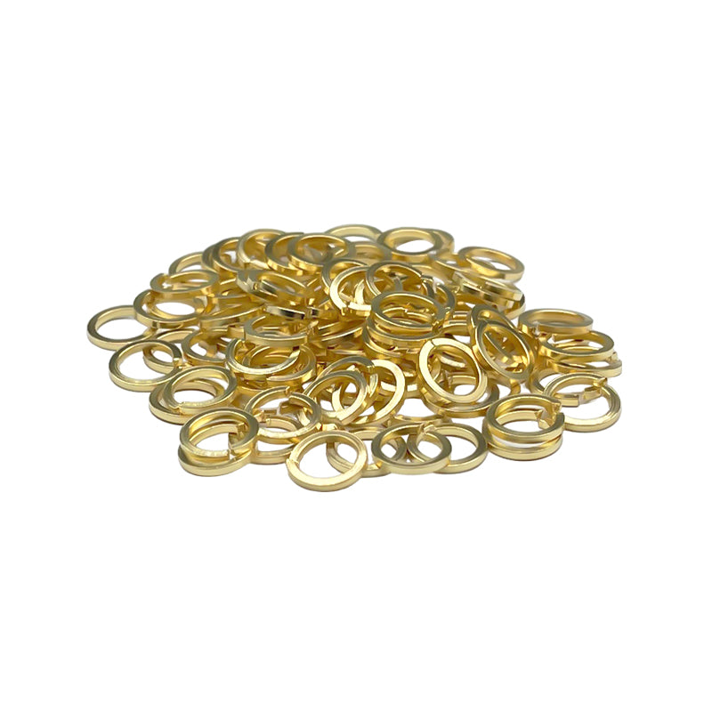 Pile of gold-tone SMA connector tooth lock washers and gaskets for SMA female bulkhead mounting